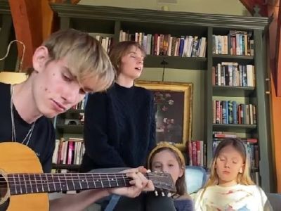 Levon Roan Thurman-Hawke is playing the guitar as Clementine Jane, Indiana, and Maya Hawke are singing.